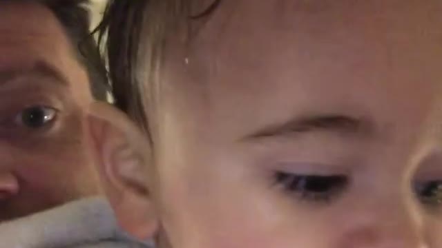 Cute baby taking shower