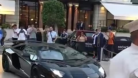 Billionaire lady boss getting out of Lamborghini SV