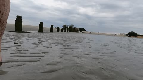 Panning away from the water to sea beachside GoPro