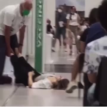 Covid jab victim collapses while others wait their turn..