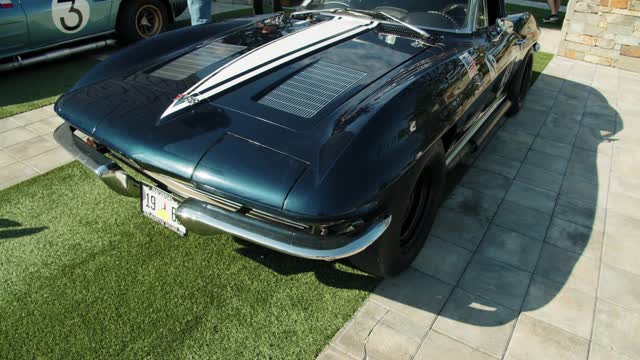 A Vintage Sports Car In Display In A Car Show