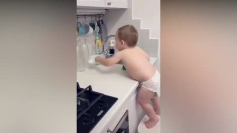Baby is working in the kitchen.