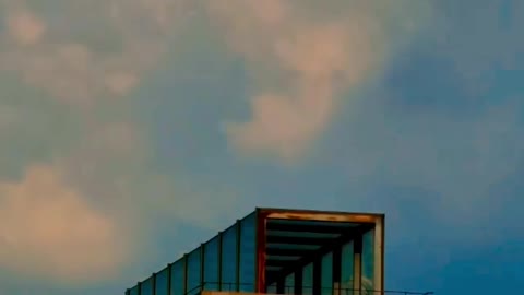 Clouds and waves on the building