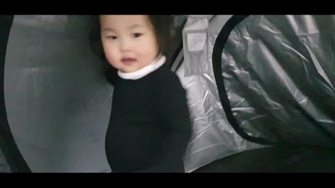 happy baby in tent