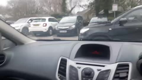 Boring coffee time. L. In car park.