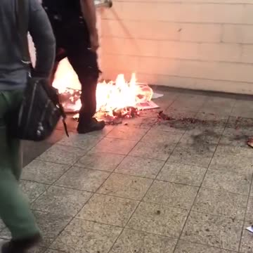 Fire in subway station put out by police officer