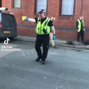 Police Officer Points Tazer at Disabled man