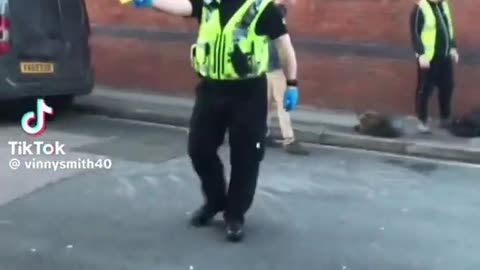 Police Officer Points Tazer at Disabled man