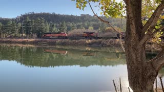 Train drive by lake