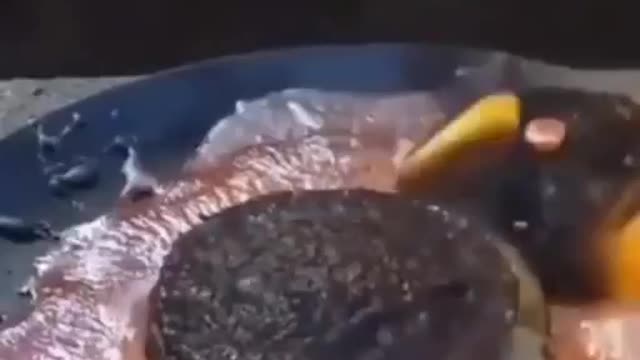 Pouring Hot Stuff over a BIG MAC