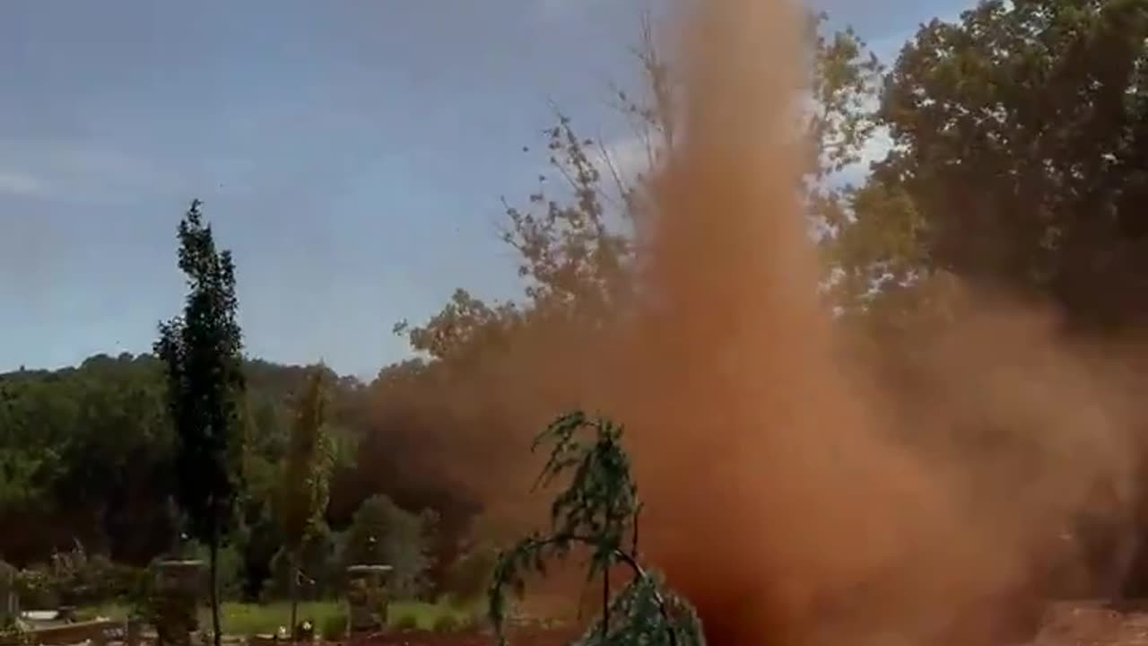 Red, twisty dust devil near Hickory, North Carolina