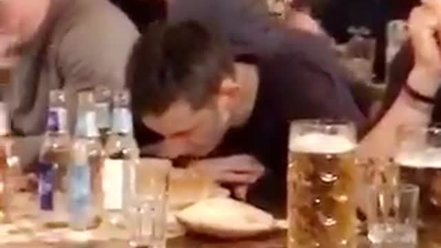 Nsfw guy in black shirt throwing up on table