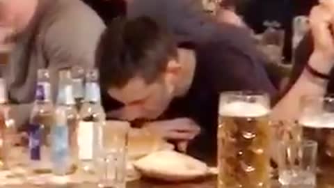 Nsfw guy in black shirt throwing up on table