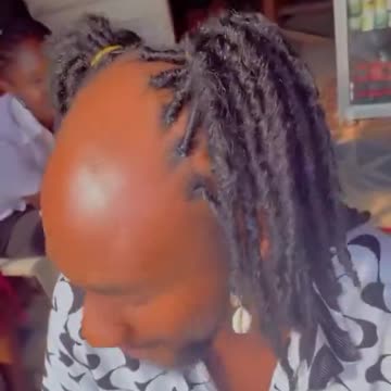 Lady uses her client’s unique hairstyle to encourage people in his class