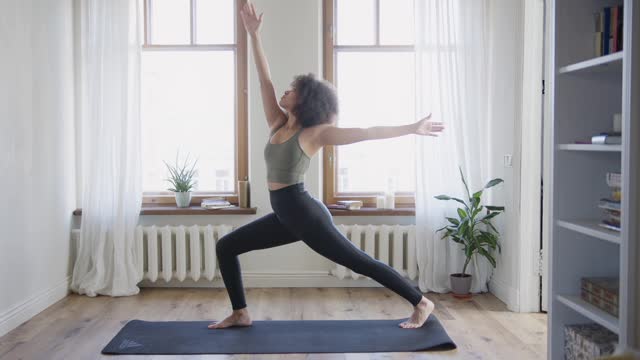 A Woman Doing Stretch Exercises At Home