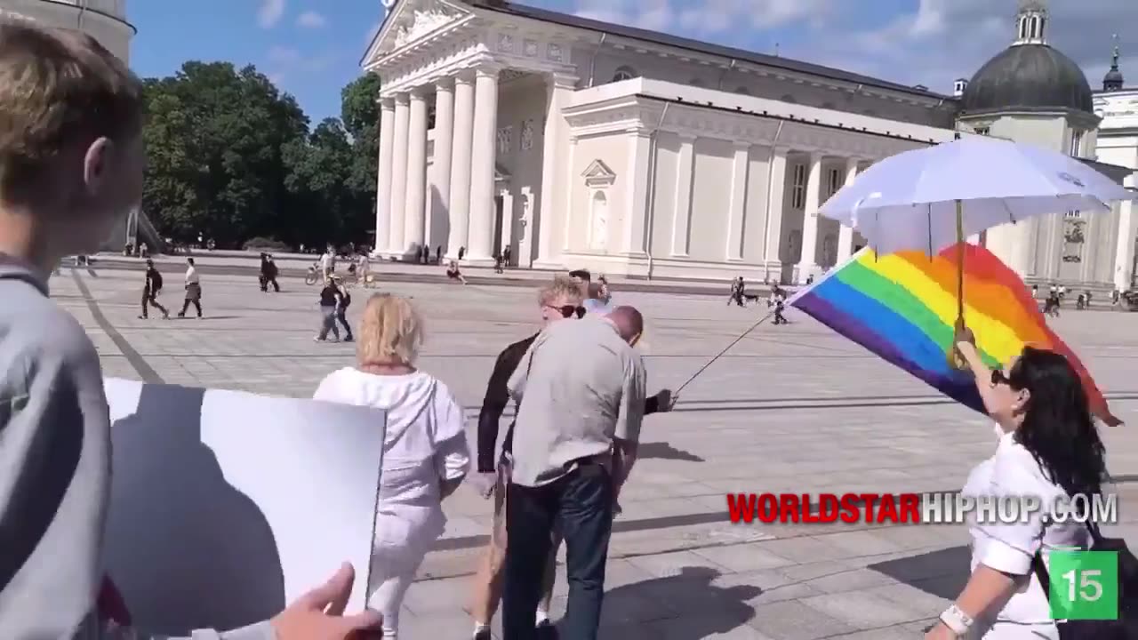 Man Gets Punched In The Face For Harassing Man Holding Rainbow Flag