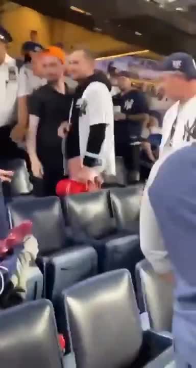Deranged lib tries stealing guy’s MAGA hat at Yankee's game. Get's OWNED by NYC crowd.