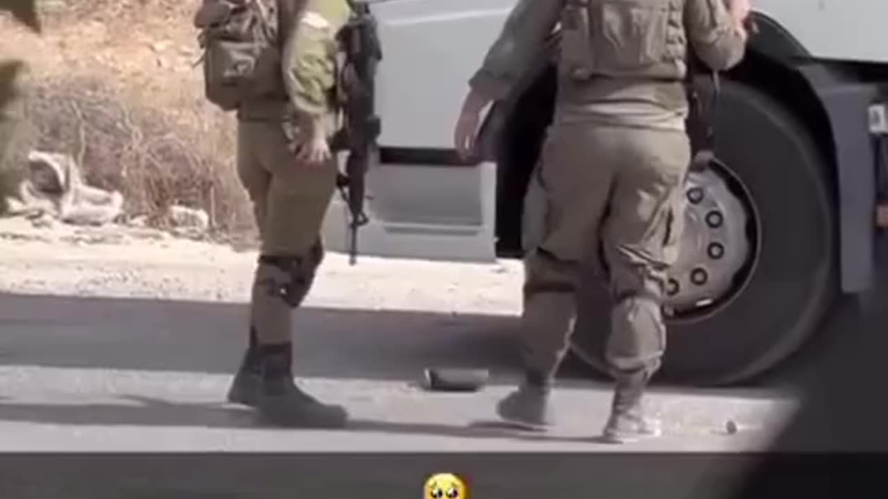 A soldier attacks a truck driver and shoots his truck tire