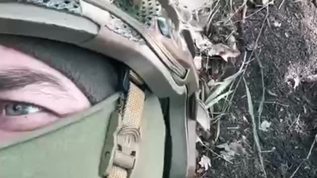 Ukrainian troops filming themselves under Russian artillery fire in their trenches.
