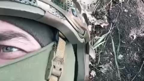 Ukrainian troops filming themselves under Russian artillery fire in their trenches.