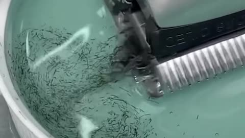 Barber cleans his clippers
