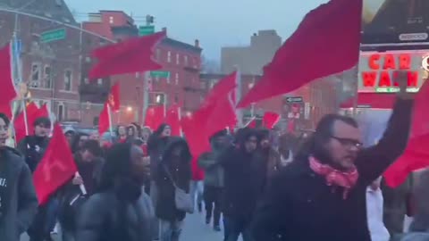 Revolting (adjective, not verb) Communists march out on the streets of New York City.