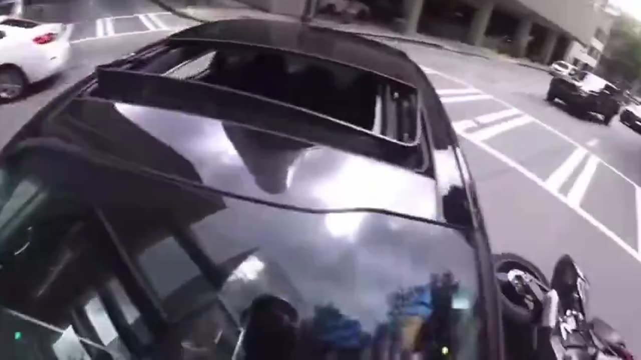 Woman Cuts Off Biker