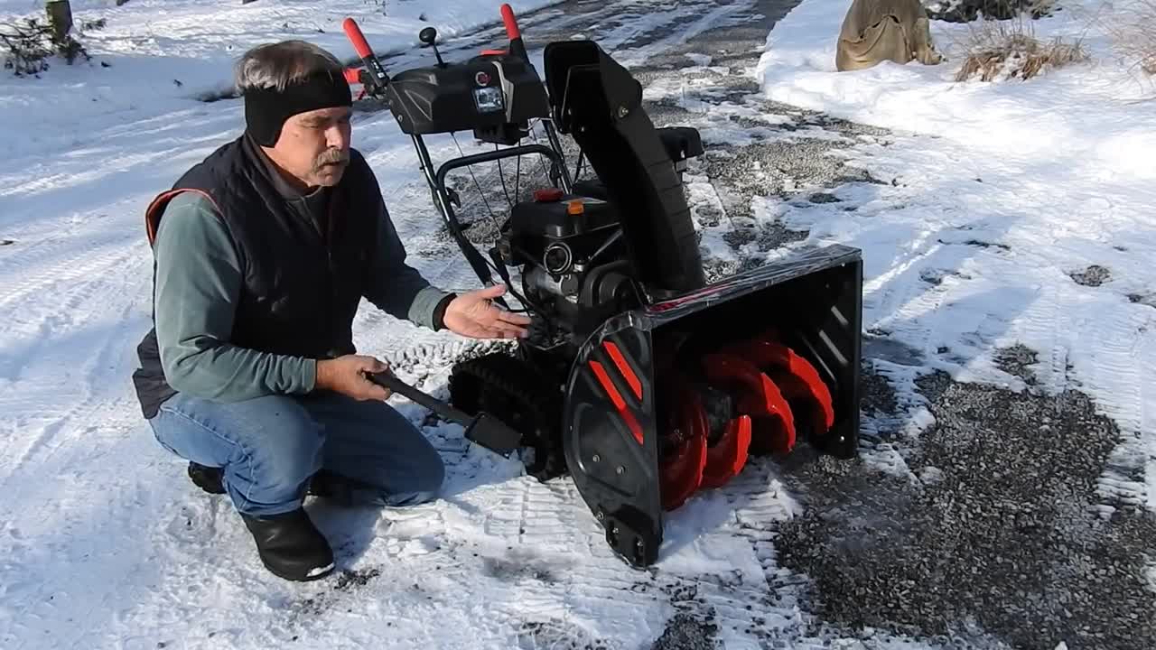 SNOWBLOWER ON A GRAVEL DRIVEWAY