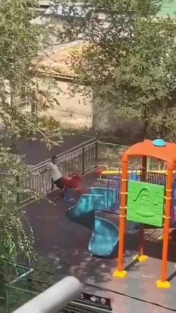 Fake asylum seeker in Europe abuses wooden horse in children's playground.