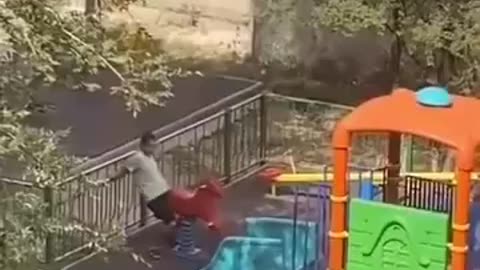 Fake asylum seeker in Europe abuses wooden horse in children's playground.