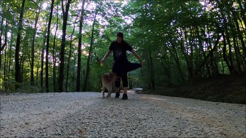 Woman Playing with Her Dog Outdoors