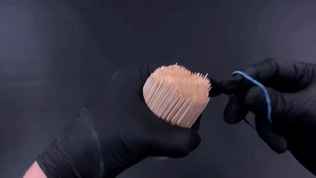 Fasten Toothpicks Together With A Leather Band