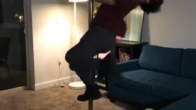 Living room strip pole breaks into glass door