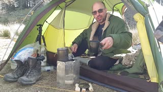 Coffee time in tent. Riverside wildcamping