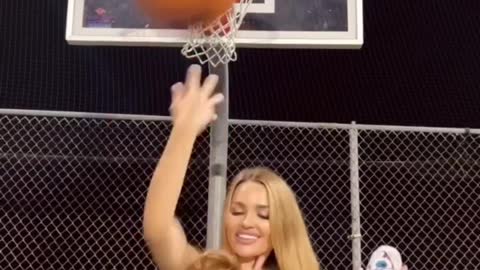 Beautiful girl playing busketball