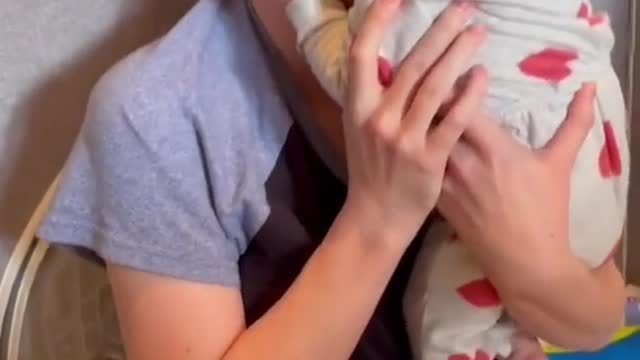 Cute baby and mother kissing