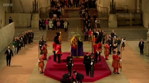 the new normal : Royal guard at the Queen's coffin has collapsed.