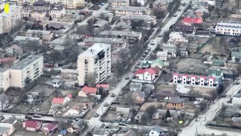 New drone imagery shows Russian forces firing on a cyclists in Bucha,