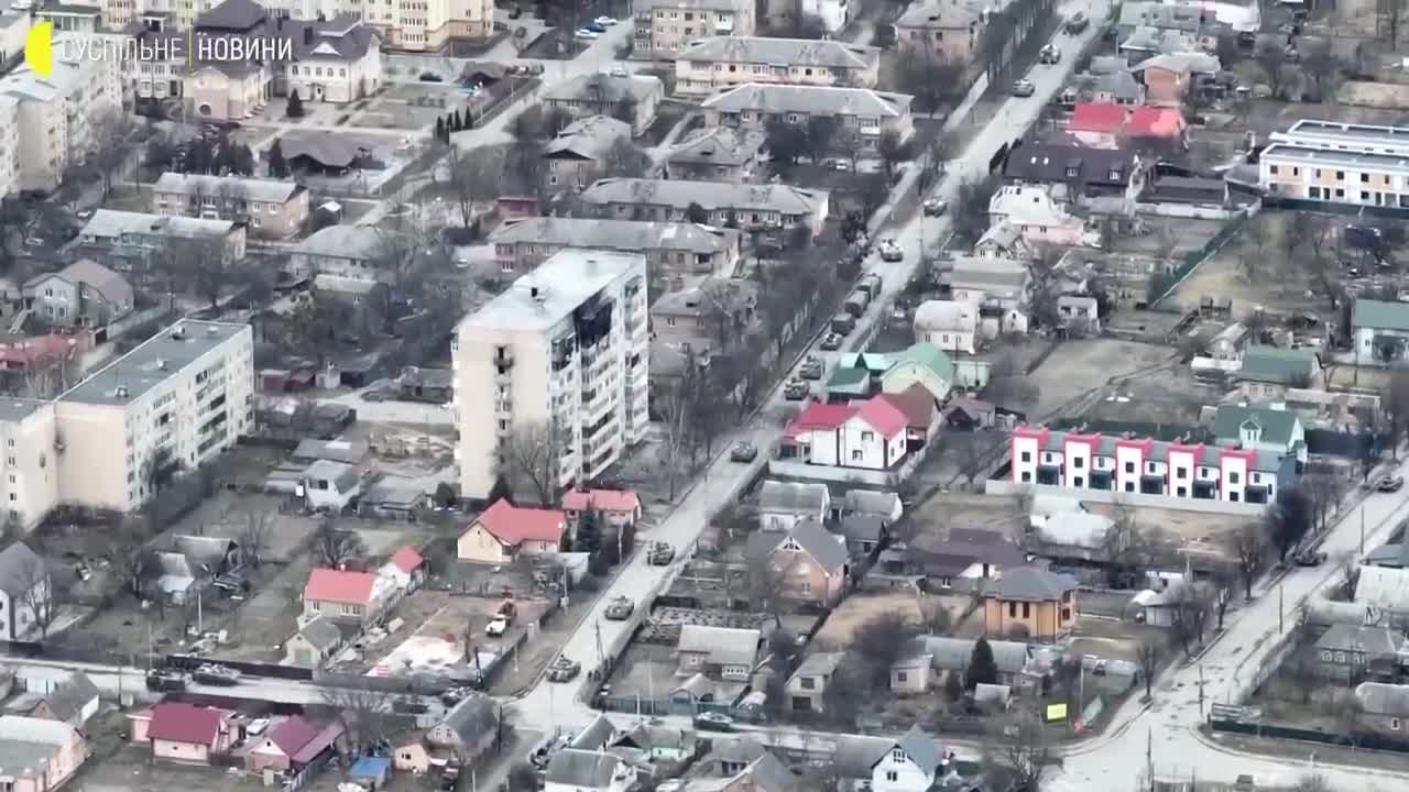 New drone imagery shows Russian forces firing on a cyclists in Bucha,