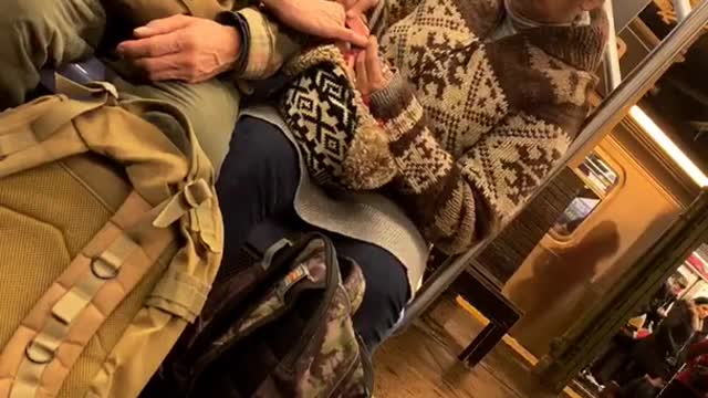 Woman filing old mans nails