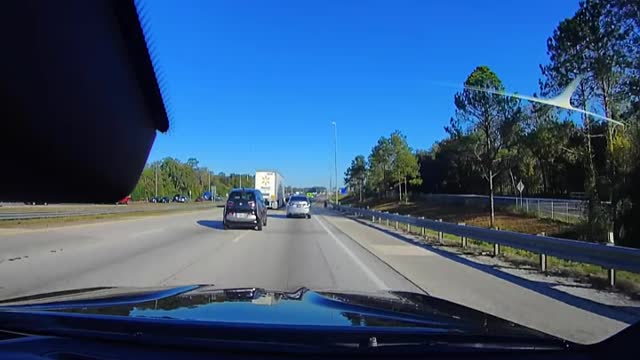 BMW driver cuts off car behind me , then me. We honk. He goes nuts!