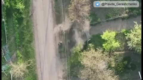 Ukrainian drone dropping explosives on Russian soldiers