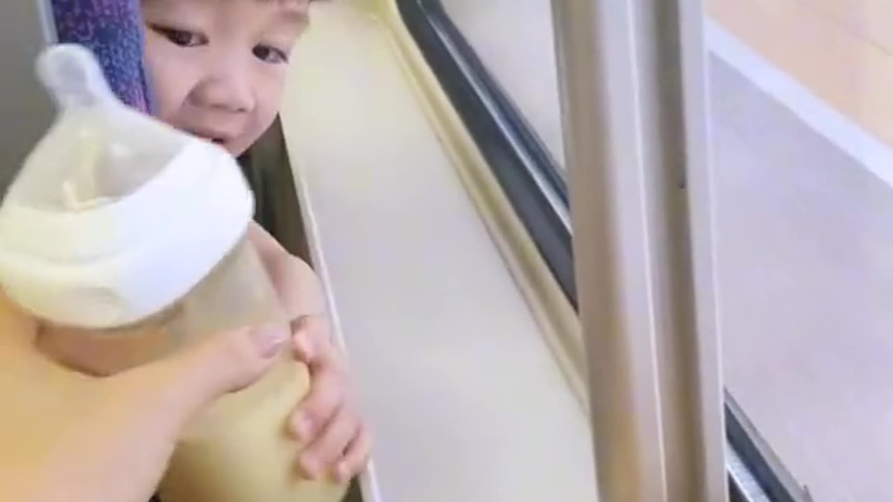 Cute japanese baby girl in a train