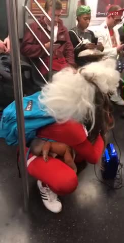 Pregnant santa rapping subway