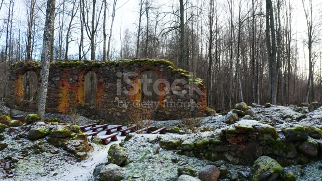 Abandoned church boulder wall remains with new seats