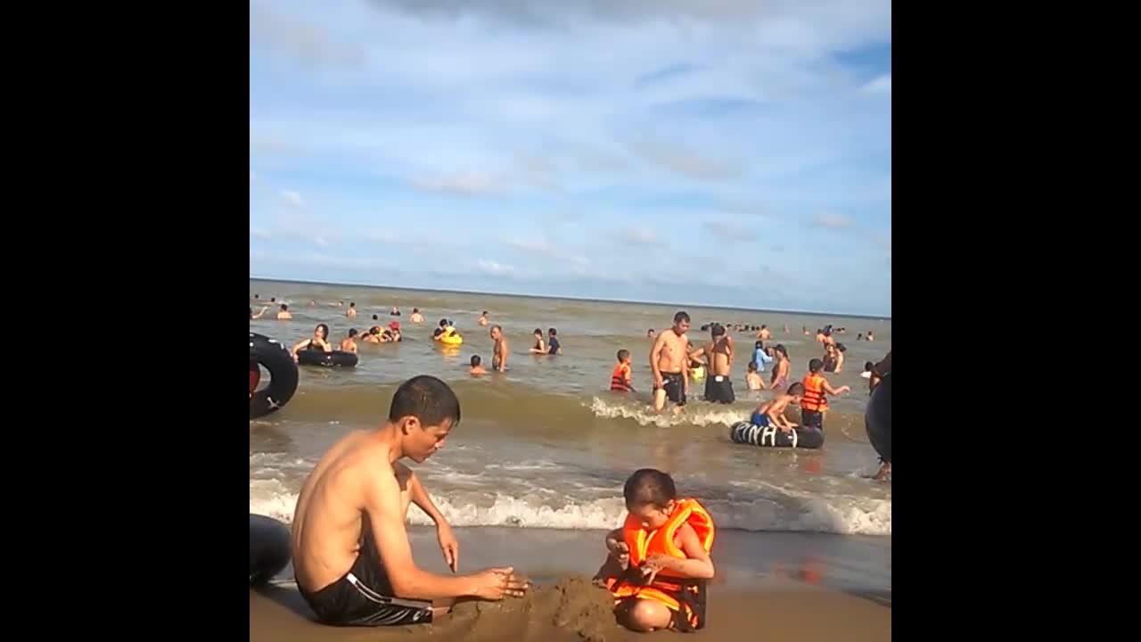 Daughter baby and father on the beach