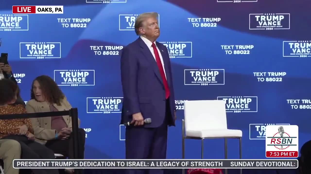 Trump appears lost, confused, and frozen on stage as multiple songs play for 30+ minutes