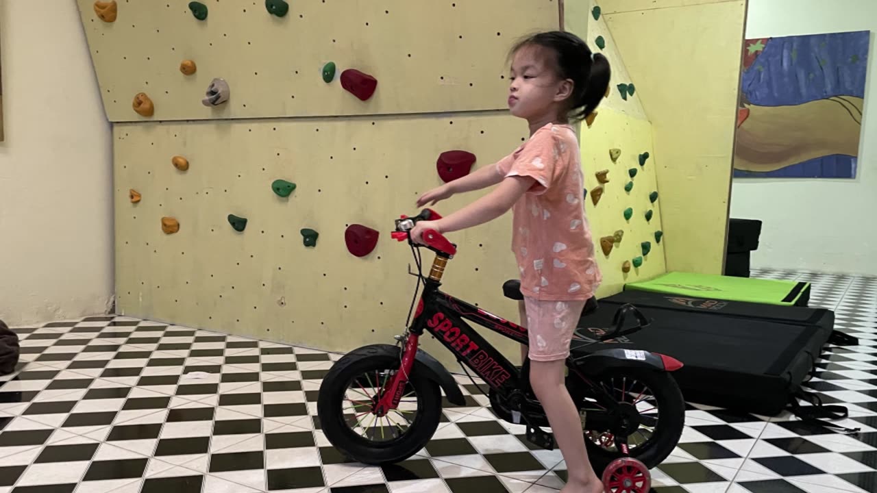 Ping Riding Her Bike