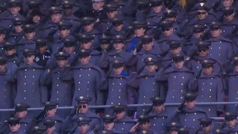 President Donald J. Trump salutes as the National Anthem is performed at the Army-Navy Game.