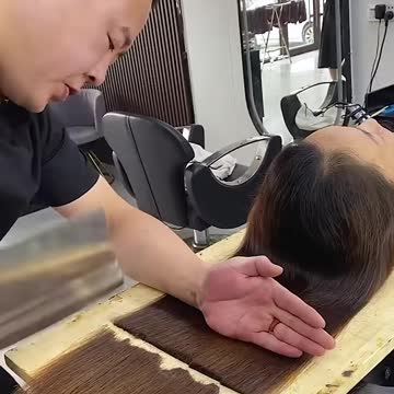 Chopping her hair in a weird way